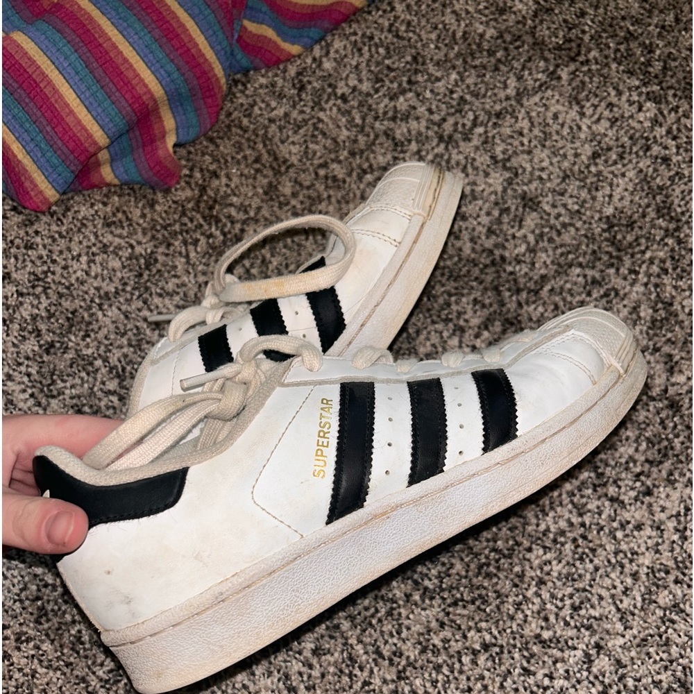 White and black adidas superstars. Size 7.5